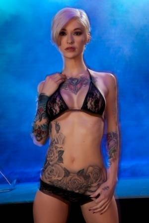 Hot tattooed Kleio Valentien sheds black lace panties to squat & spread legs on girlsabc.com