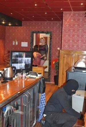 Amateur chick Kimberly Scott and a girlfriend disrobe a hooded male robber on girlsabc.com