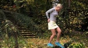 Cute blonde Victoria Pure hikes her skirt to take a pee along country lane on girlsabc.com