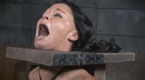 Restrained brunette London River is forced to suck a black penis on girlsabc.com