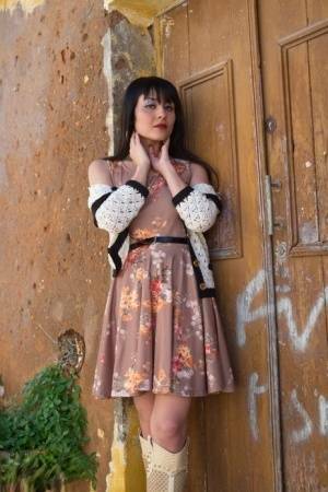Asian model Sophia Jade flashes her upskirt panties on a cobblestone street on girlsabc.com