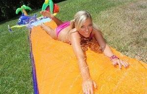 Young blonde Ally Kay ends a water fight by having sex in backyard on girlsabc.com