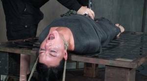 London River is mummified and tied down before being throat fucked in dungeon on girlsabc.com