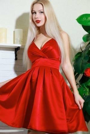 Nice blonde teen Genevieve Gandi removes red dress to display her trimmed muff on girlsabc.com