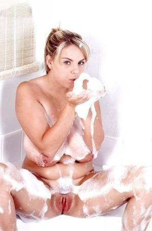 Plump Euro babe Kelly Kay soaps up huge pornstar juggs in bathtub on girlsabc.com