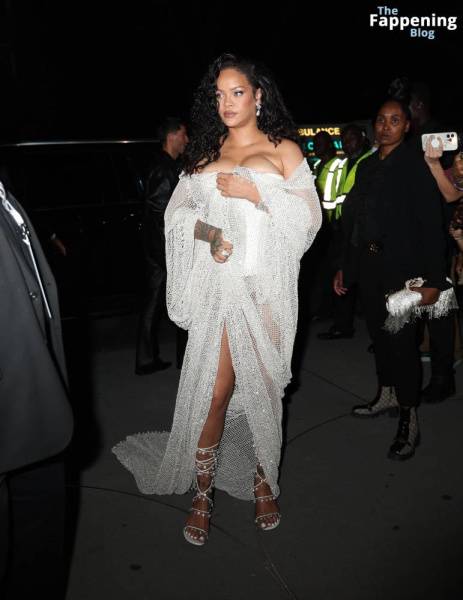 Rihanna Displays Her Curves in a White Dress (13 Photos) on girlsabc.com